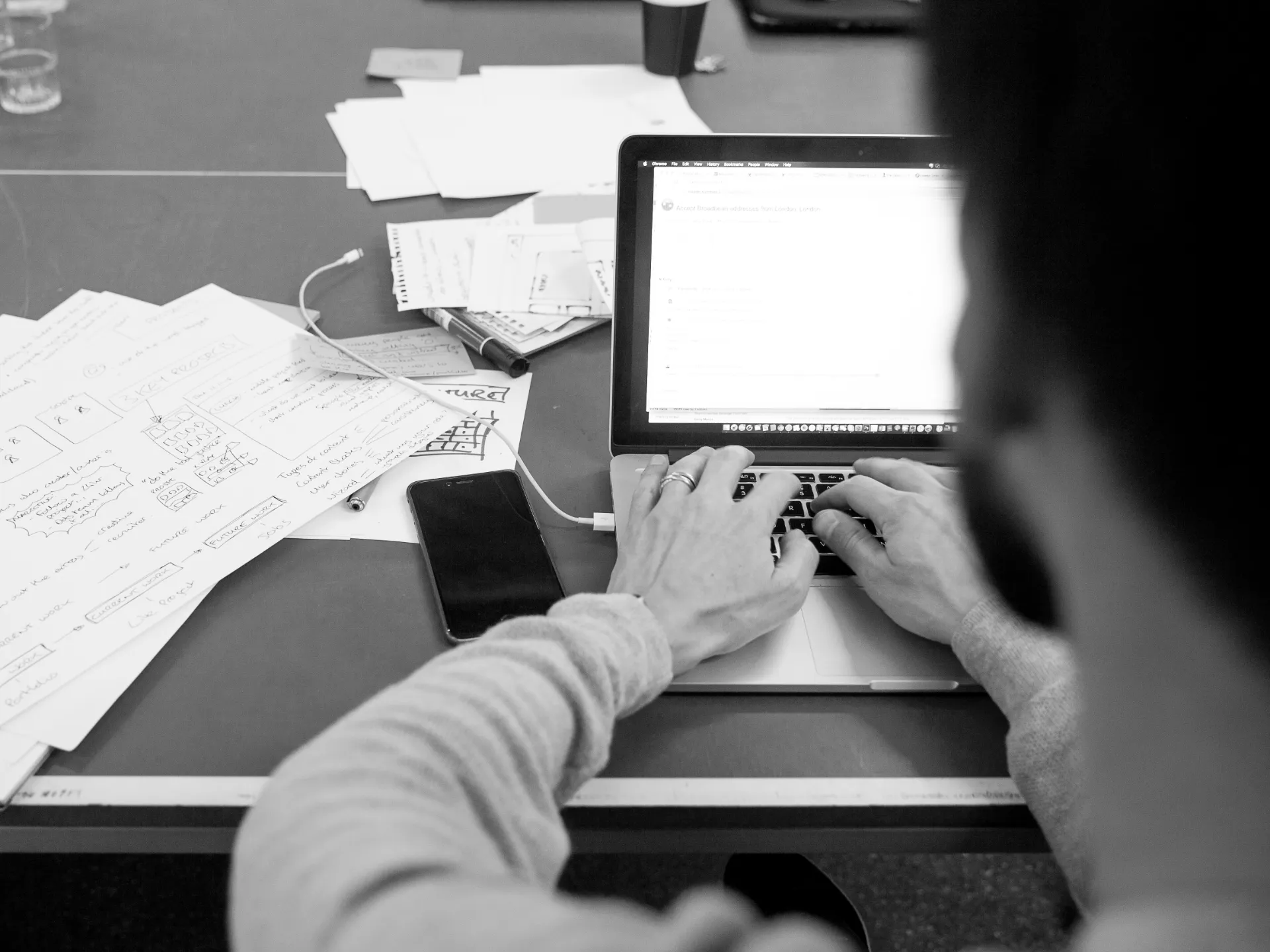 Working session — sketched profile and project concepts beside the research
