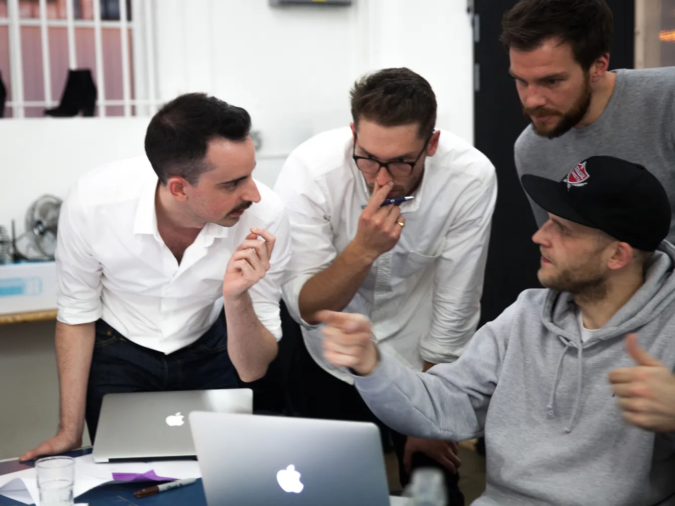 Joshua Baker, Nick Hallam, Harry Harrison, and Mark Jenkins in a workshop